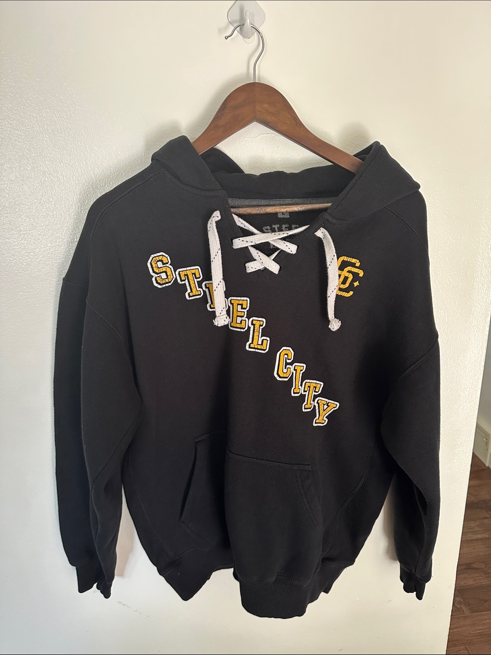 Steel City Black Men’s Hooded Sweatshirt with Lace-Up Neck and Yellow Lettering